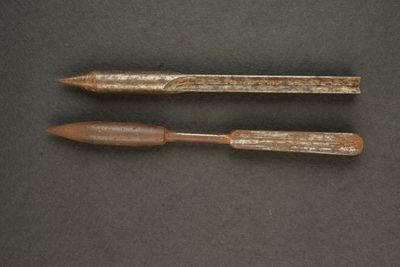 an image of two wooden pencils sitting on top of a table
