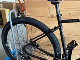 a bike that is sitting on a stand in a garage