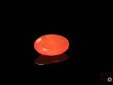 an image of a glowing orange stone on a black surface