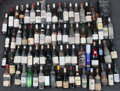 many bottles of wine sitting on the floor next to each other