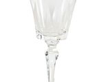 a wine glass that is sitting on a table