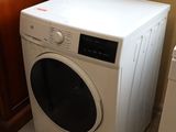 a washer and dryer in the corner of a room