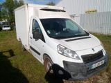 a white van that is parked in the grass