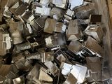 a box full of silver metal pieces in a box