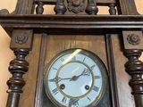 a wooden clock that is on a table