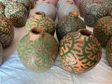 many vases that are sitting on a table