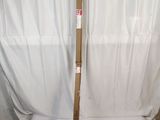 a wooden pole that is leaning up against a white backdrop