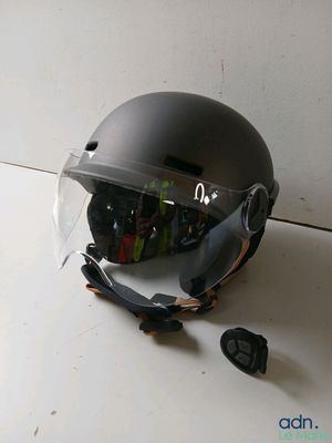 a helmet that has been smashed and is sitting on the floor