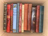 a box full of books that are sitting on a shelf