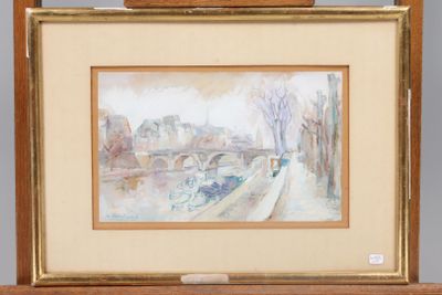 an image of a painting on a easel with a painting of a bridge in the background