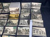 a lot of old black and white photos on the table