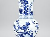blue and white vase with birds and flowers on it