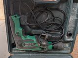 a tool in a case that is sitting on the ground