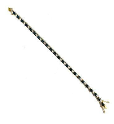 an image of a black and white diamond bracelet on a white background
