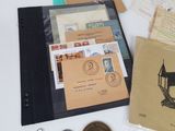a lot of stamps and other items that are on the table