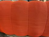 a close up of a large orange pumpkin sitting on top of a pallet