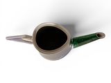 an image of a coffee pot with a green handle