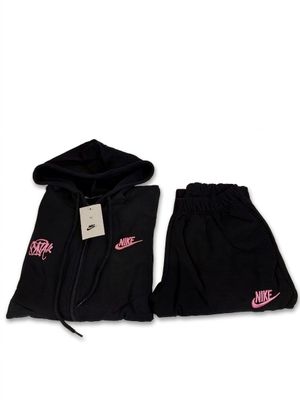 the nike hoodie and shorts are black and pink