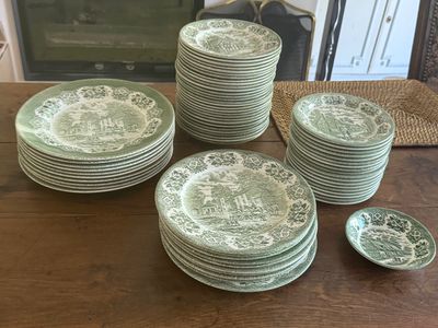 a lot of plates that are sitting on a table