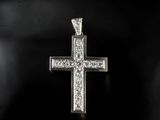 a diamond cross pendant on a black background