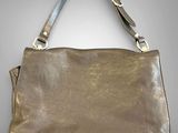 an image of a brown leather purse on a gray background