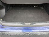 a trunk of a blue car with its trunk open