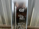a metal mailbox with a dragon design on it