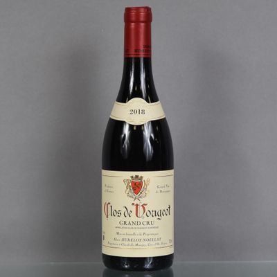 a close up of a bottle of wine on a table