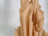 a vase that has a bunch of folded paper in it