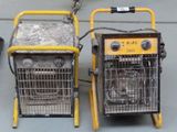 two portable heaters sitting next to each other on the floor