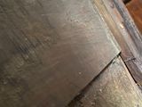 a close up of a piece of wood on the floor