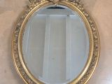 a mirror hanging on the wall in a room