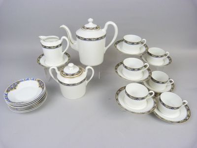 a lot of cups and saucers that are on the table