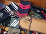 a suit case filled with ties and a pair of glasses