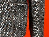 a close up of a sweater on a mannequin mannequin