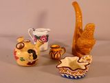 many different types of pottery items on the table