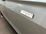 a picture of a car with a sticker on the door