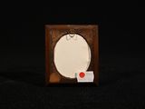 a picture of a picture frame with a red button on it