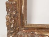 an image of a picture of a wooden frame with carvings on it
