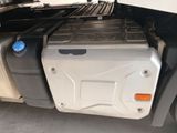 a truck with a large container on the back of it