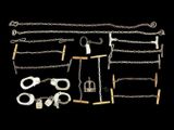 a group of metal chains and shacks on a black background