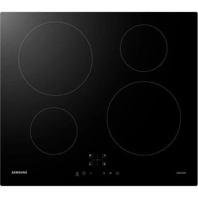 a close up of a black stove top with four burners