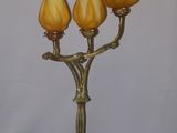 a lamp that is sitting on a table next to a pair of scissors
