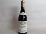 a bottle of wine that is sitting on a table