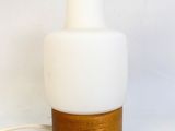 a white table lamp with a wooden base and a white glass shade