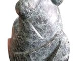a stone sculpture of a woman on a white background