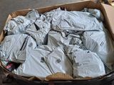 a box full of bags of luggage sitting on the floor