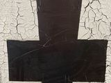 a cross painted on the wall of a building