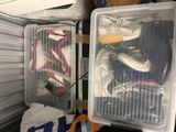 many pairs of shoes in a plastic container