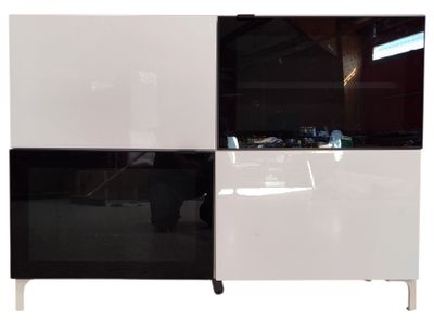 a picture of a white and black cabinet with two doors